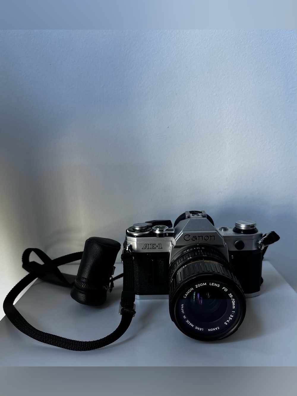 Canon Silver and Black 35mm SLR Camera with Zoom Lens and Strap